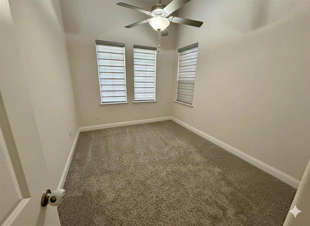 6842 Albany Park Frisco, TX 75034 - Photo 18 of 21 a view of a livingroom with a ceiling fan and window