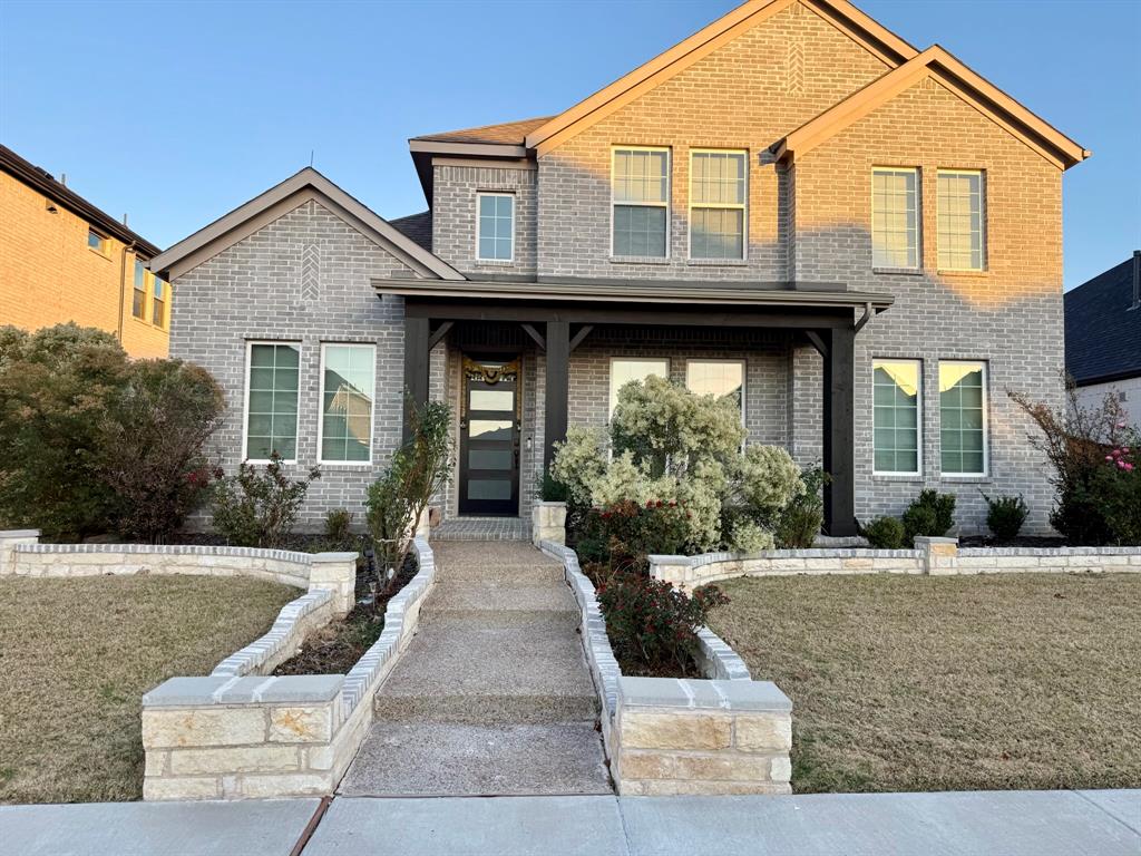 6842 Albany Park Frisco, TX 75034 - Photo 2 of 21 a front view of a house with porch