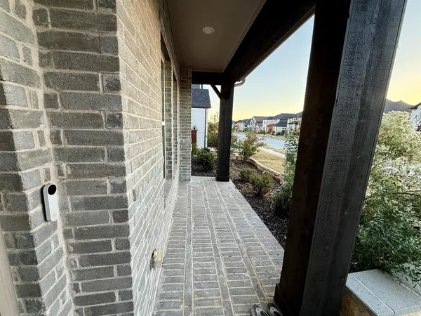 a view of balcony with floor to ceiling window and outdoor view