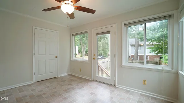 a view of an empty room with a window