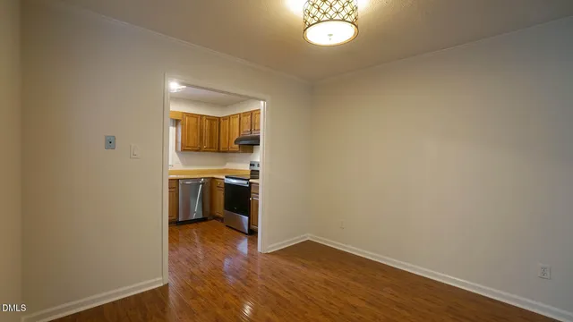 a view of a kitchen with a sink and a stove top oven