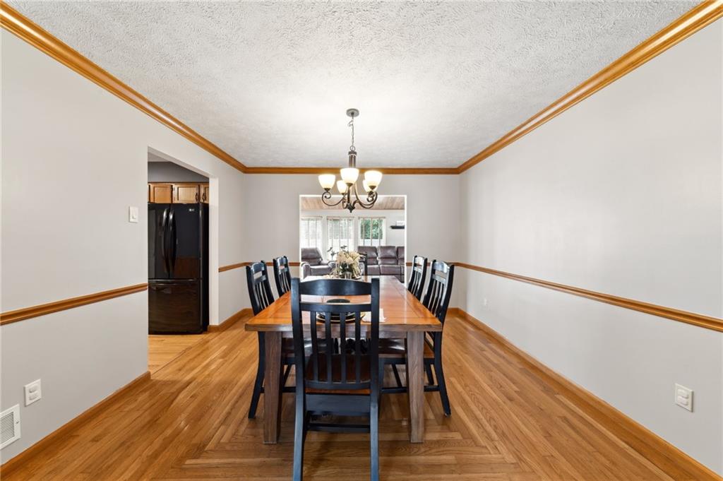 116 Buttercup School Road Renfrew, PA 16053 - Photo 18 of 34 a view of a dining room with furniture and wooden floor