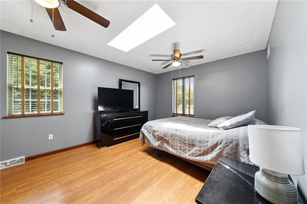116 Buttercup School Road Renfrew, PA 16053 - Photo 26 of 34 a bedroom with a bed and a flat screen tv