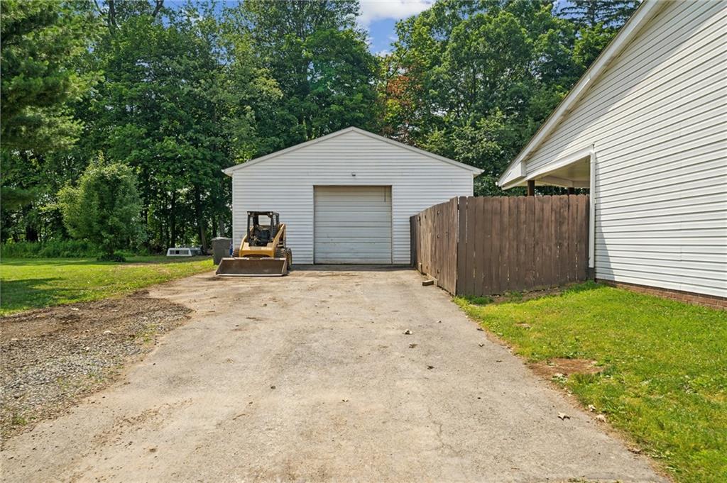 116 Buttercup School Road Renfrew, PA 16053 - Photo 4 of 34 a view of a backyard with a garden and garage