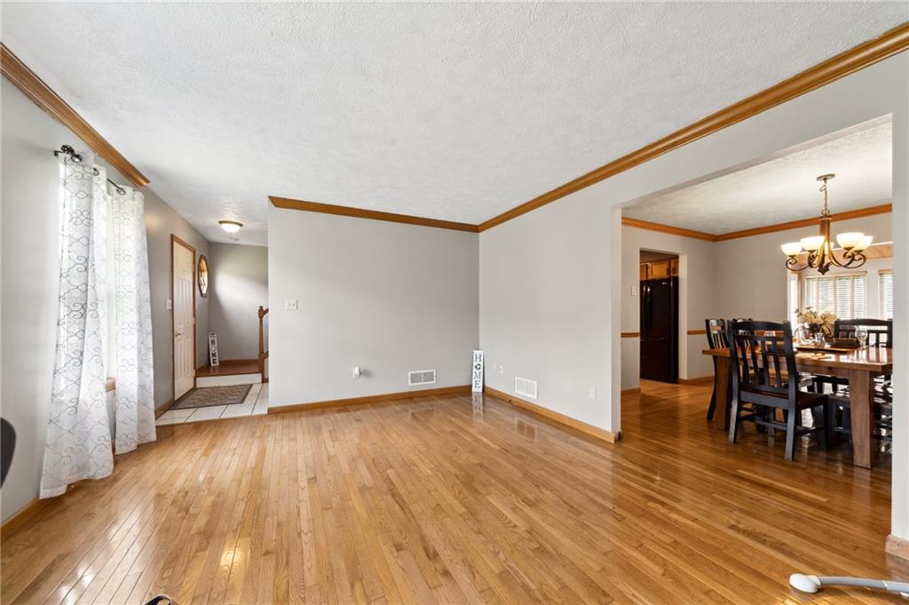 116 Buttercup School Road Renfrew, PA 16053 - Photo 10 of 34 a view of a livingroom with furniture and wooden floor