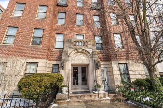 a front view of a building with garden