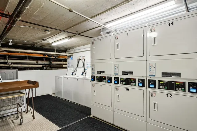 a kitchen with a cabinets and white appliances