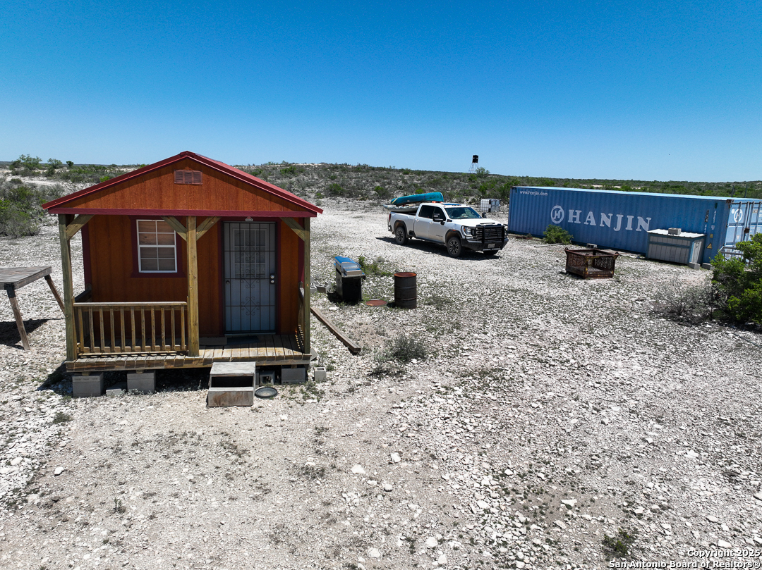 1935 Wolf Spgs Road Comstock, TX 78837 - Photo 5 of 15 a view of a house with a yard and wooden fence
