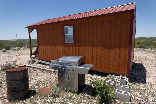 a view of a back yard of the house