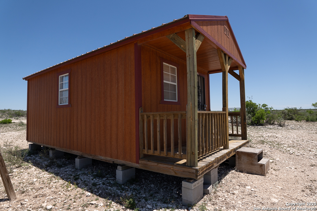1935 Wolf Spgs Road Comstock, TX 78837 - Photo 10 of 15 a backyard of a house