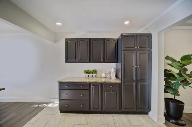 a view of a dining room with furniture and window