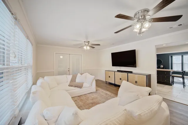 a living room with furniture and a large window