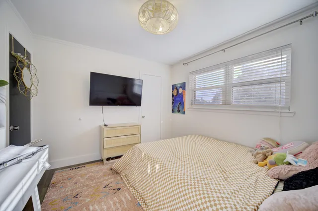a bathroom with a sink a toilet and shower curtain