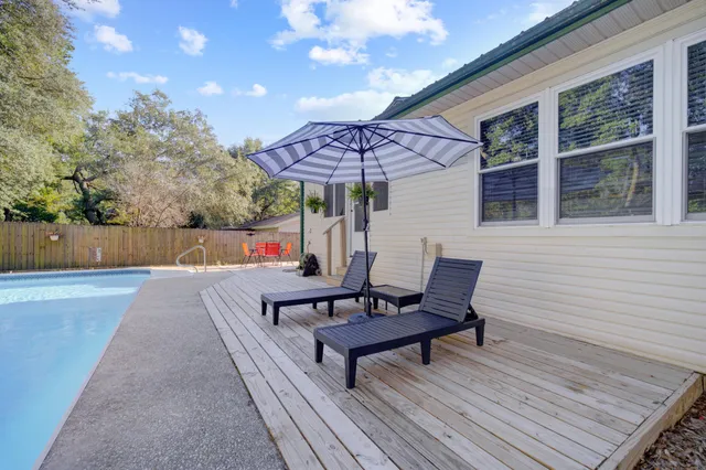 a roof deck with a table and a chairs