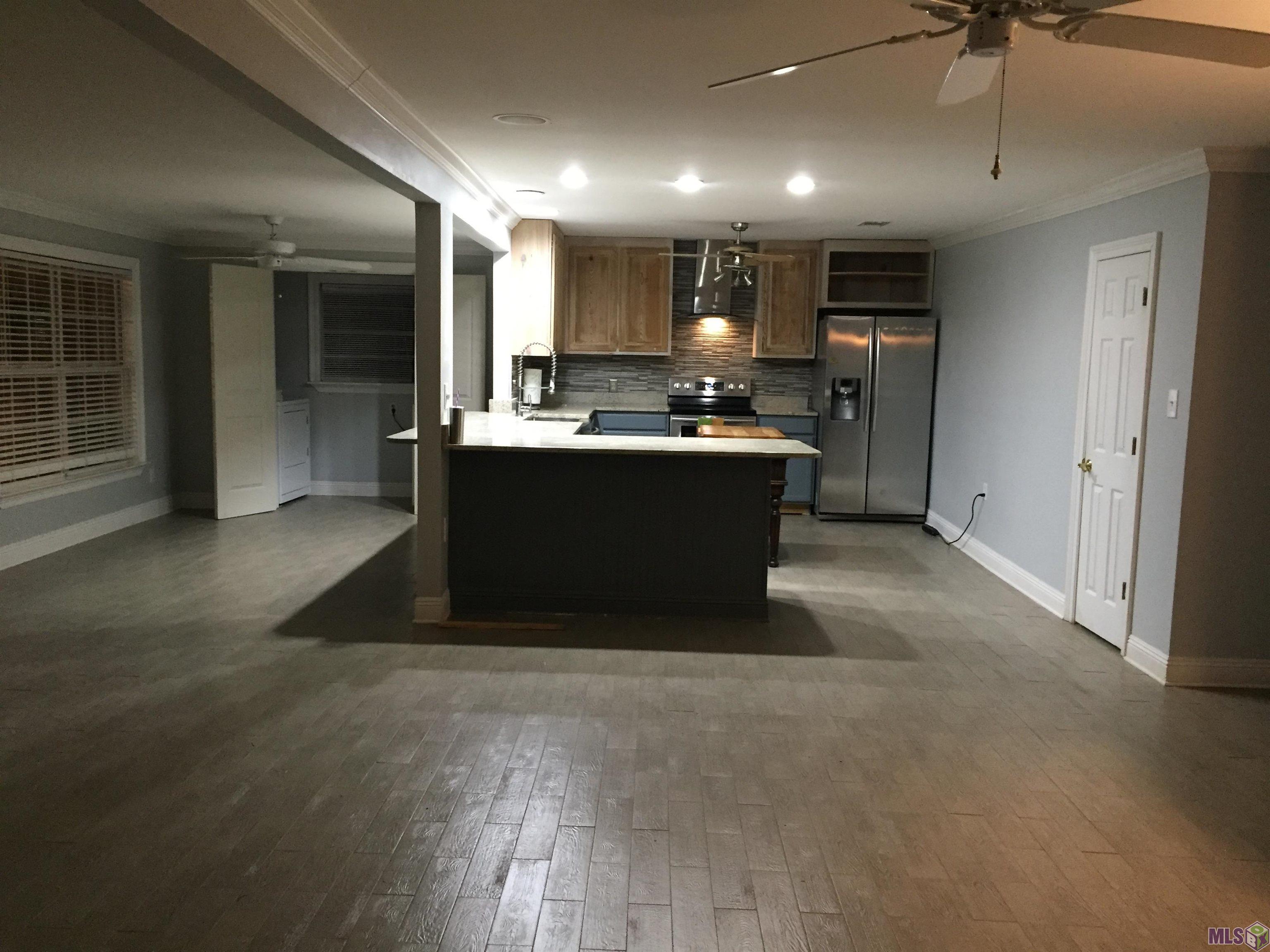 20320 Patricia Street Springfield, LA 70462 - Photo 12 of 28 Large Open Space For Living Rm Dining & Kitchen
