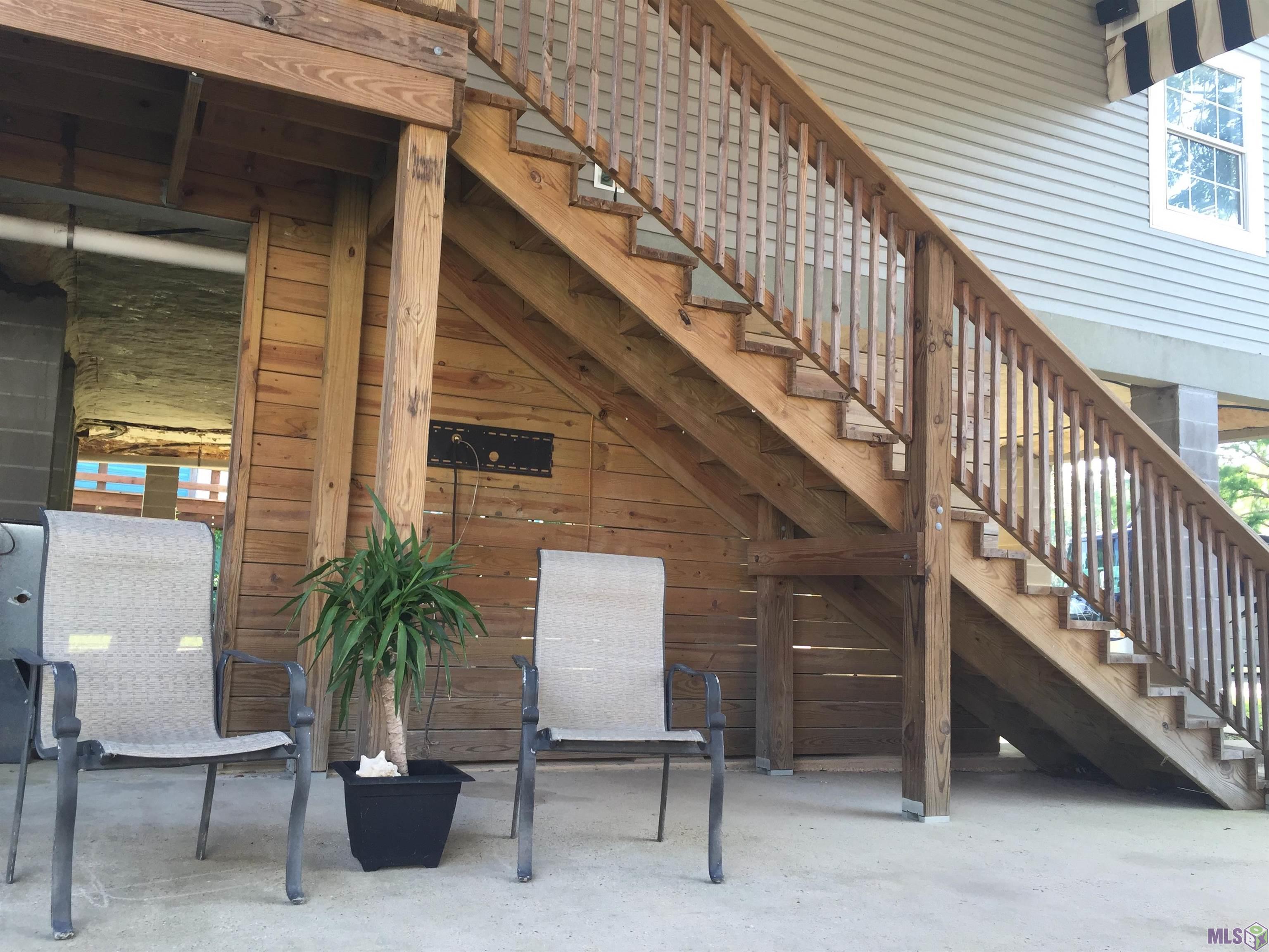 20320 Patricia Street Springfield, LA 70462 - Photo 2 of 28 Front stairs from patio to Living room