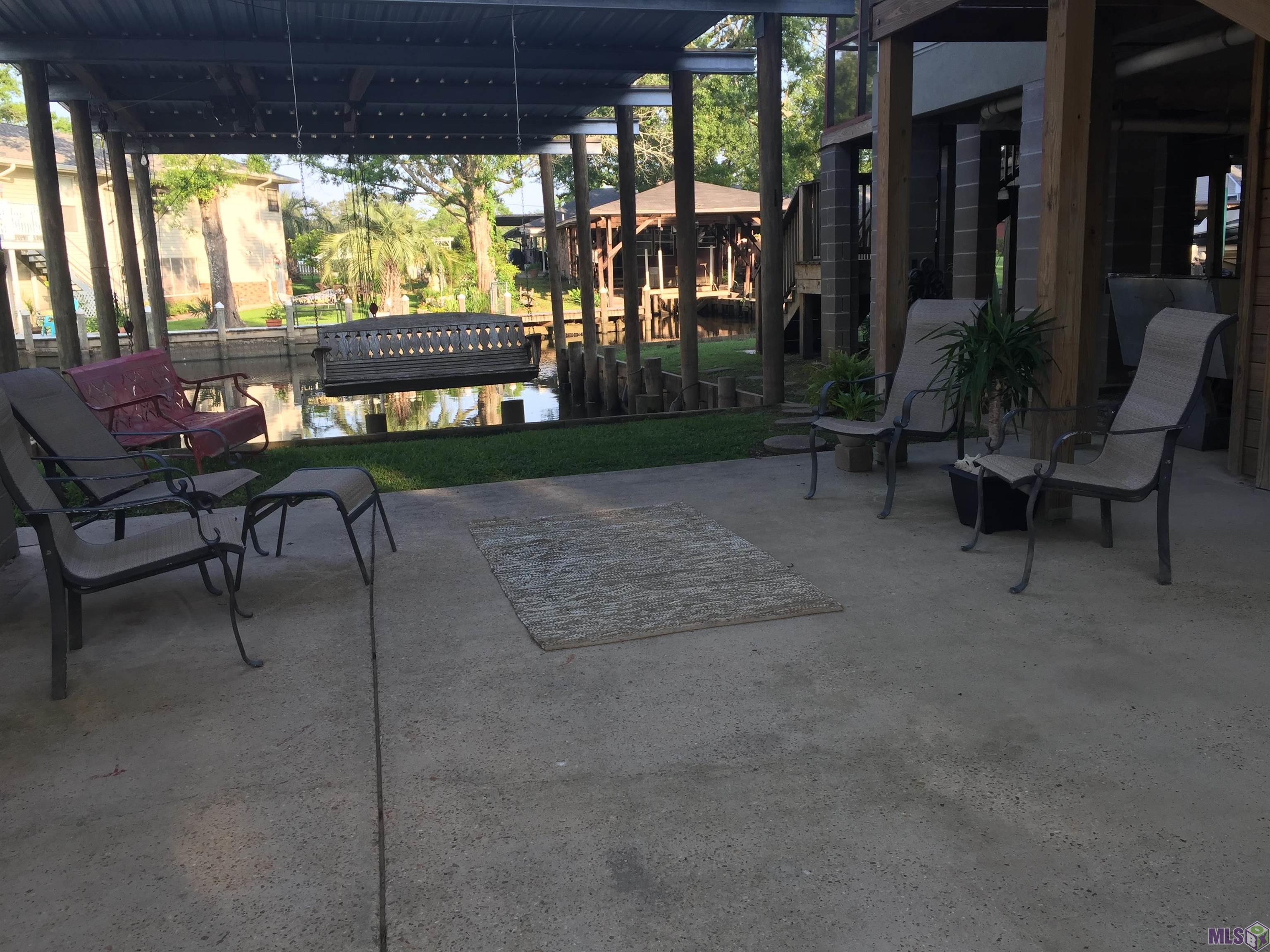 20320 Patricia Street Springfield, LA 70462 - Photo 3 of 28 Patio area in front of double boat port