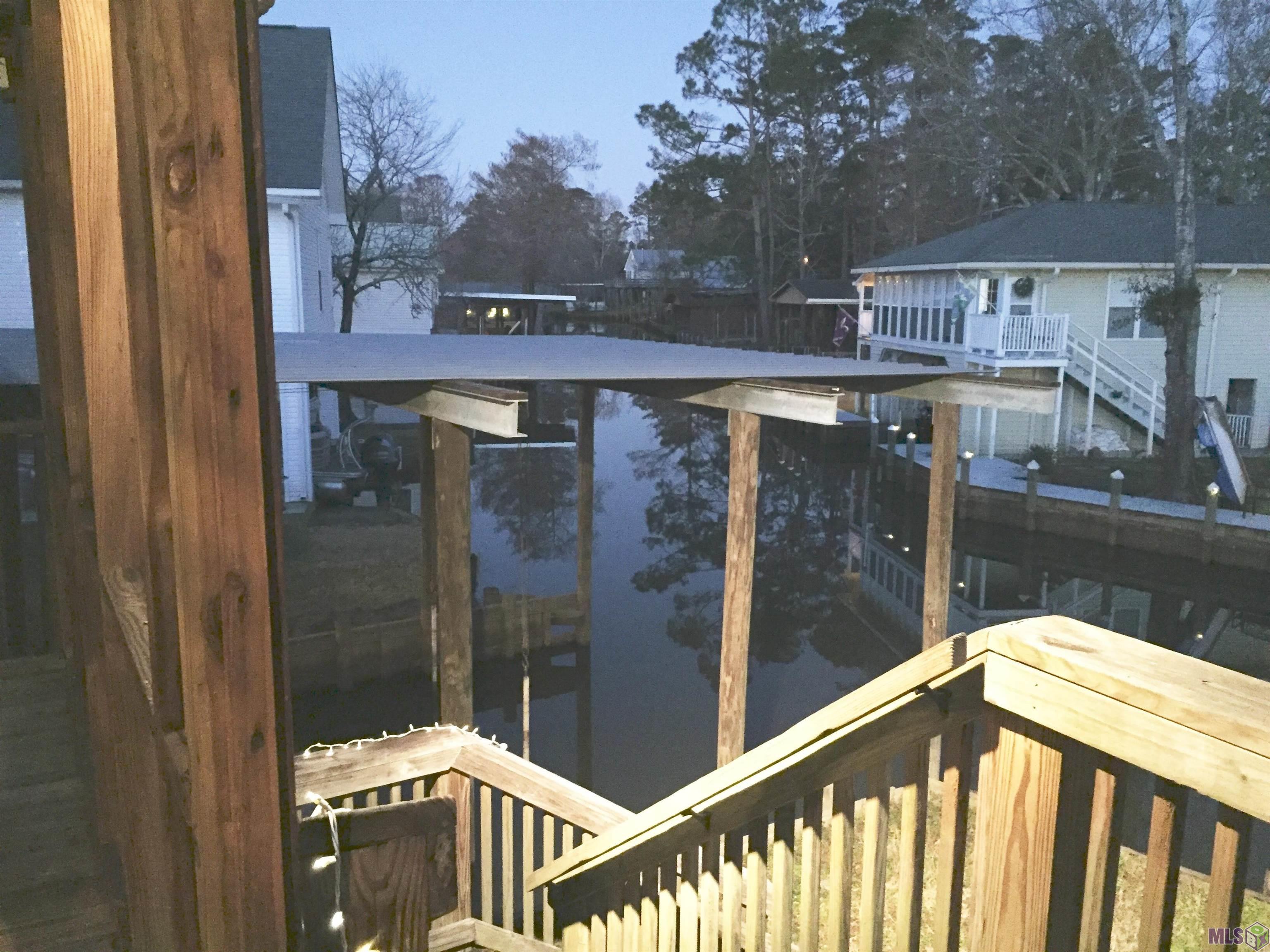 20320 Patricia Street Springfield, LA 70462 - Photo 9 of 28 Back Steps Leading From Back Porch to Water