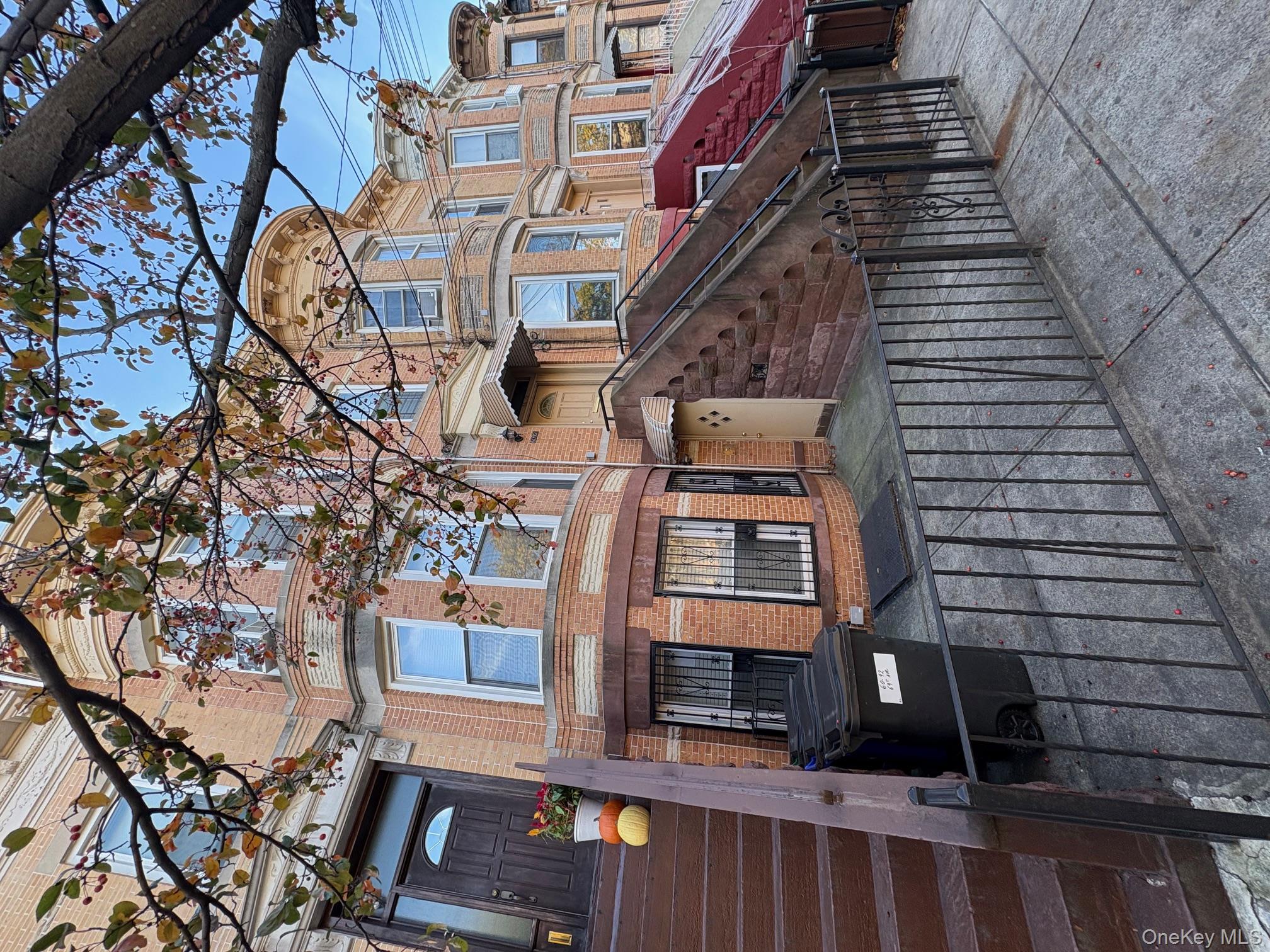 60-92 69th Avenue Queens, NY 11385 - Photo 2 of 2 a front view of a building with a glass windows