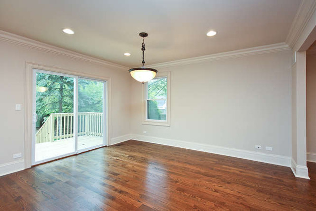 1035 Willow Road Winnetka, IL 60093 - Photo 14 of 25 a view of an empty room with wooden floor and a window