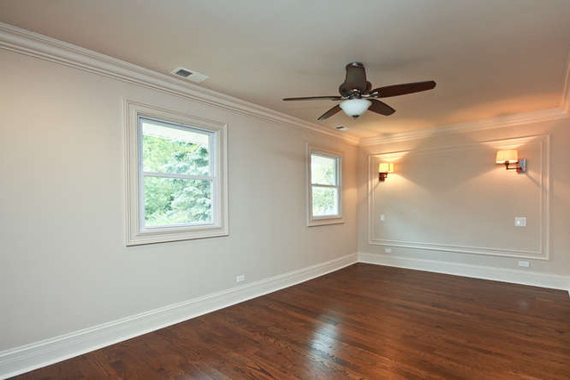 1035 Willow Road Winnetka, IL 60093 - Photo 16 of 25 an empty room with wooden floor chandelier fan and windows