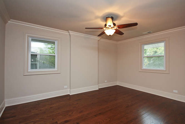 1035 Willow Road Winnetka, IL 60093 - Photo 20 of 25 a view of an empty room with wooden floor and a window