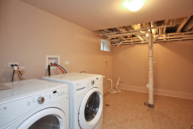 1035 Willow Road Winnetka, IL 60093 - Photo 24 of 25 a utility room with dryer and washer