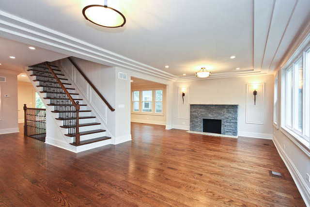 1035 Willow Road Winnetka, IL 60093 - Photo 6 of 25 a view of an empty room with wooden floor fireplace and windows