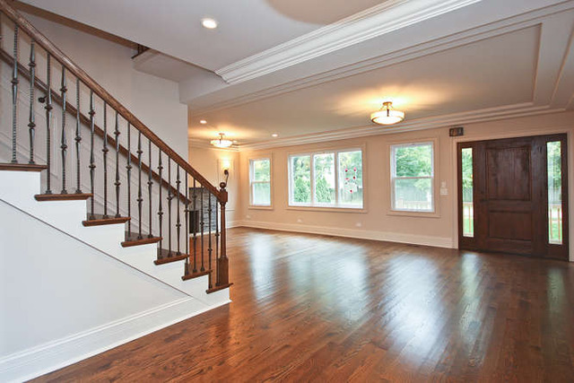1035 Willow Road Winnetka, IL 60093 - Photo 8 of 25 a view of an entryway with wooden floor and stairs