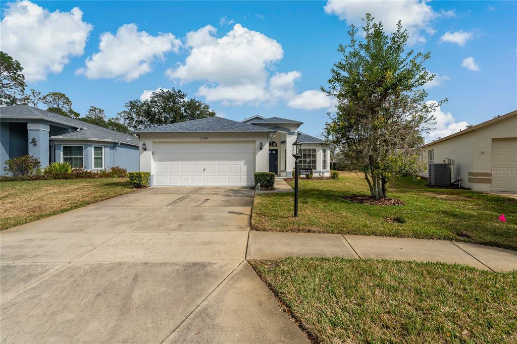 11744 Wheatfield Loop Hudson, FL 34667 - Photo 2 of 48 Front of Home