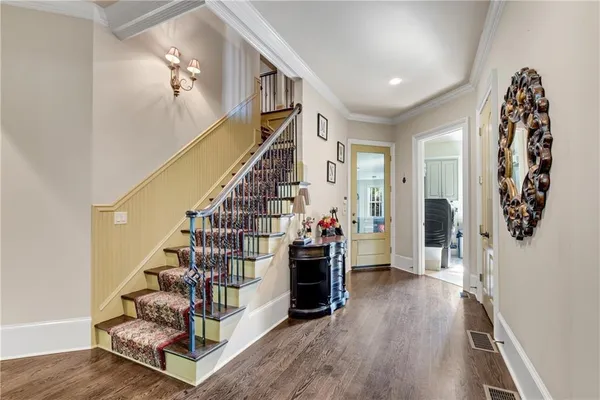 a view of entryway with stairs and wooden floor