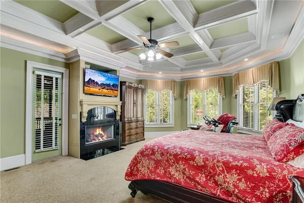 a bedroom with a bed and a fireplace