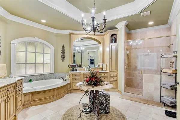 a very nice looking room with a large window and chandelier
