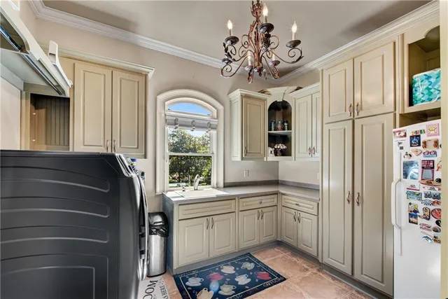 a kitchen with a refrigerator and a sink