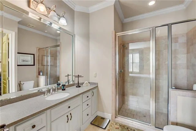 a bathroom with a shower sink and mirror