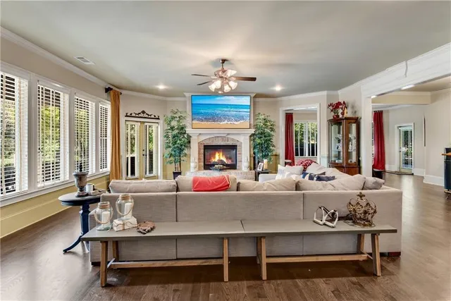 a living room with furniture fireplace and window