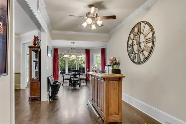 a view of a livingroom with furniture wooden floor a chandelier