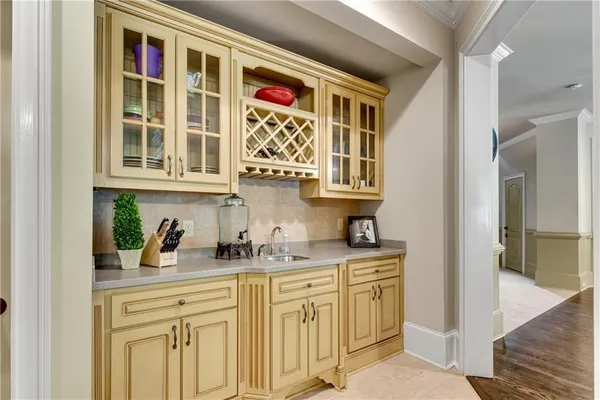 a kitchen with stainless steel appliances granite countertop a sink dishwasher and cabinets with wooden floor