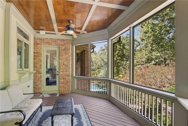 a view of a livingroom with furniture and a potted plant