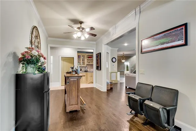 a view of a patio with table and chairs and potted plants