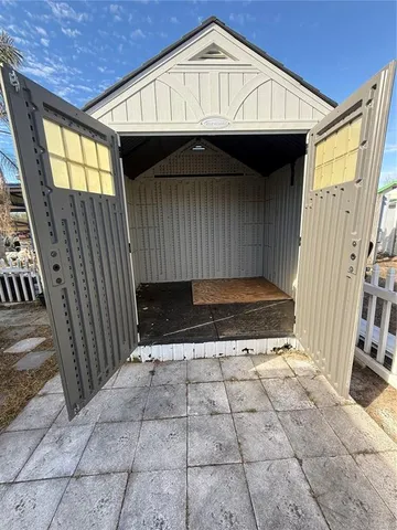 a view of closet area with wooden floor