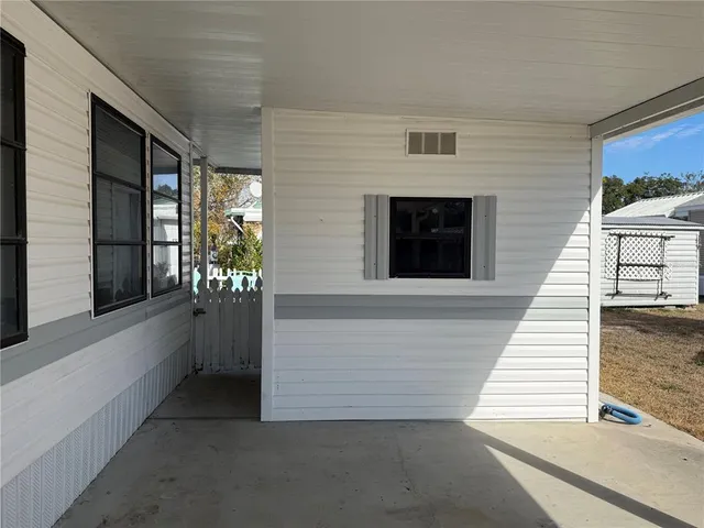 a view of a balcony with furniture