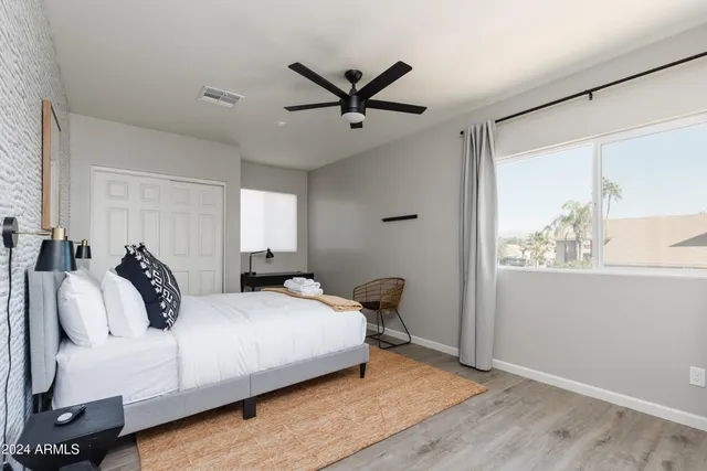 a bedroom with a bed and window