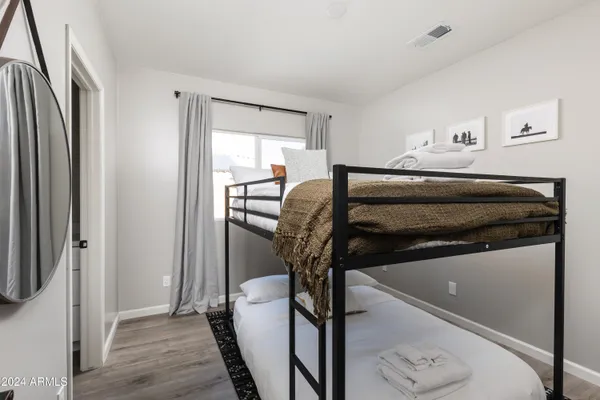 a bathroom with a double vanity sink and mirror