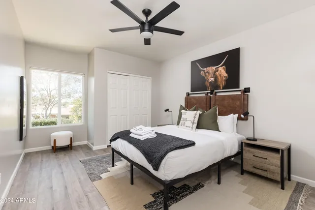 a bedroom with a bed and a window