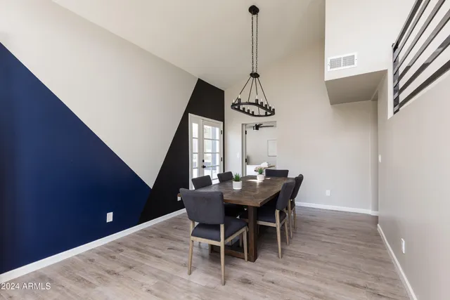 a view of a hallway with furniture and stairs