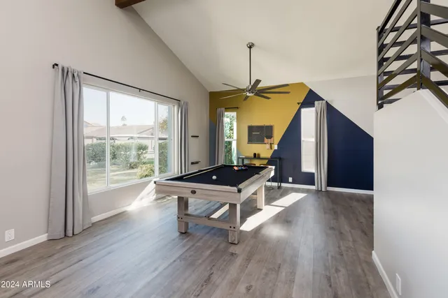 a view of an entryway with wooden floor