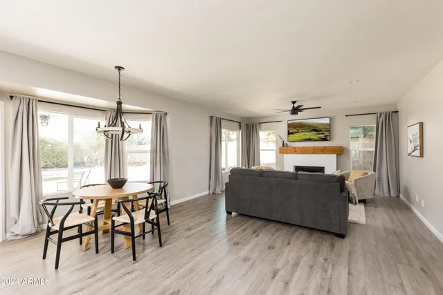 a view of a patio with a table and chairs