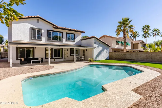 a view of swimming pool with a yard