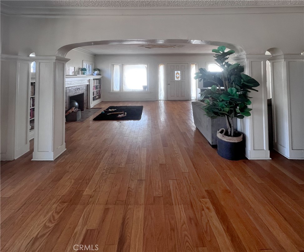 4301 Arlington Avenue Los Angeles, CA 90008 - Photo 15 of 18 a view of a hallway with wooden floor and a potted plant
